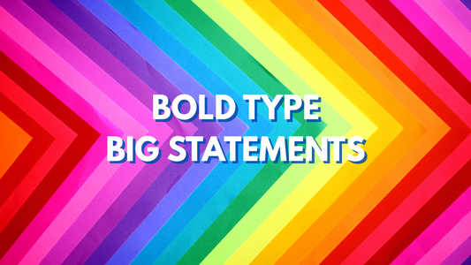Diagonal rainbow-colored chevron pattern background with bold white text in the center that reads “BOLD TYPE BIG STATEMENTS”.