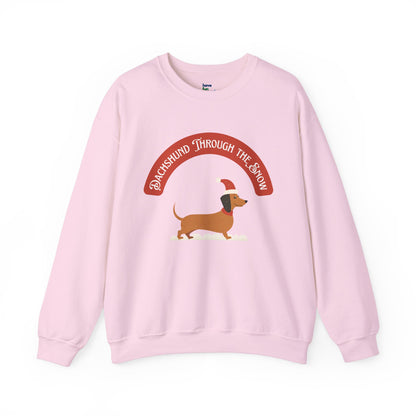 Dachshund Through the Snow | Unisex Heavy Blend™ Crewneck Sweatshirt - Sweatshirt | A quirky, joy-filled design from Have Fun Spread Joy.